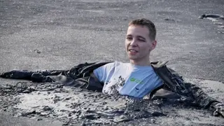 In a leather jacket and neoprene in the mud