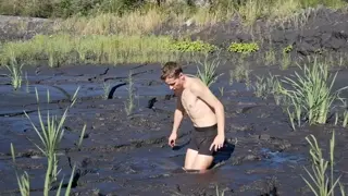 mud man stuck quicksand