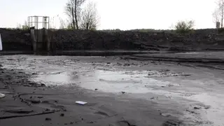 bussines man stuck in coal mud